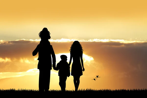 Šťastná rodina při západu slunce — Stock fotografie