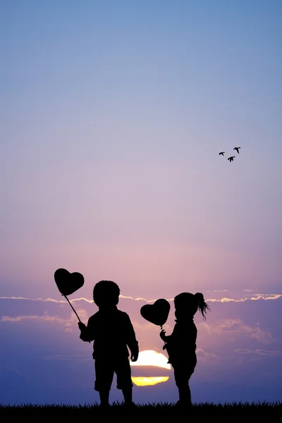 Children with hearts balloons — Stock Photo, Image