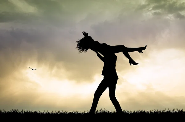 Couple dancing at sunset — Stock Photo, Image