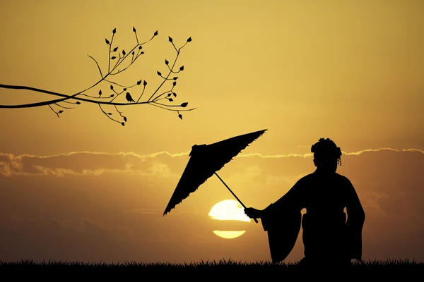 Japanese woman at sunset — Stock Photo, Image