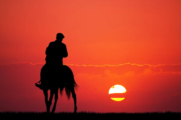 Uomo a cavallo al tramonto — Foto Stock