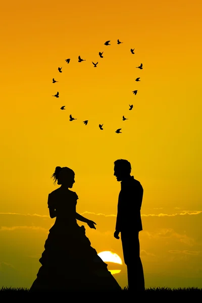 Bride and groom at sunset — Stock Photo, Image