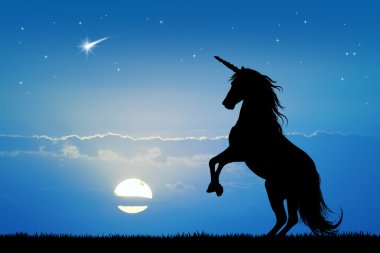 Tek boynuzlu at gün batımında