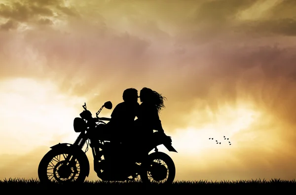 Couple kissing on motorbike — Stock Photo, Image