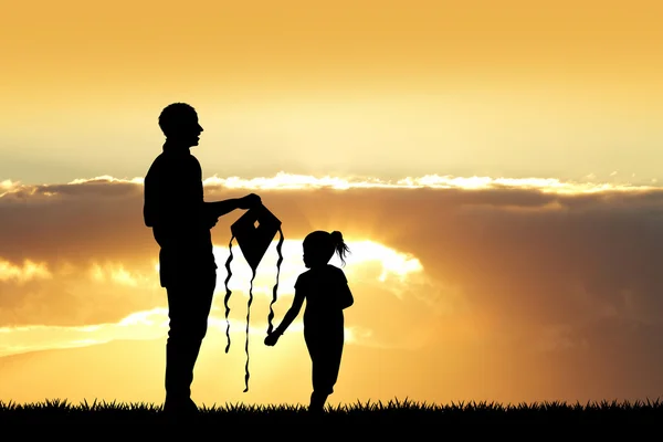 People with kite silhouette at sunset — Stock Photo, Image