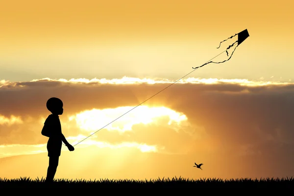 Enfant avec cerf-volant au coucher du soleil — Photo