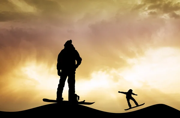 Snowboarder au coucher du soleil — Photo