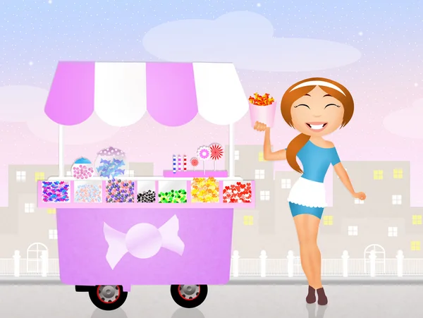 Girl and candy cart — Stock Photo, Image