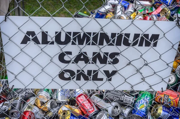 Different cans for recycling into a container — Stock Photo, Image