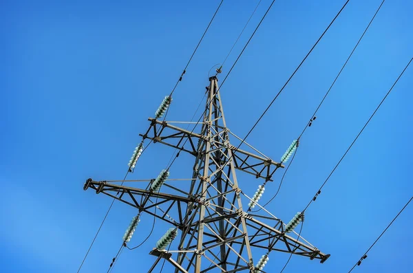 High-voltage tower on blue sky background. — Stock Photo, Image