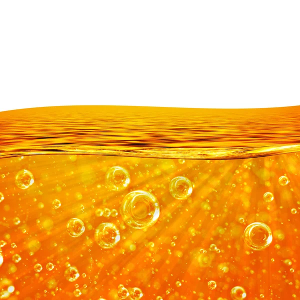 Vloeistof stroomt oranje Golf, zee, close-up luchtbellen, balken — Stockfoto