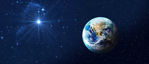 Koyu mavi gökyüzünde parlak yıldızlı Dünya gezegeni. Baner biçimi. Beytüllahim 'in Noel Yıldızı, İsa Mesih' in Noel 'i. Bu görüntünün elementleri NASA tarafından desteklenmektedir 