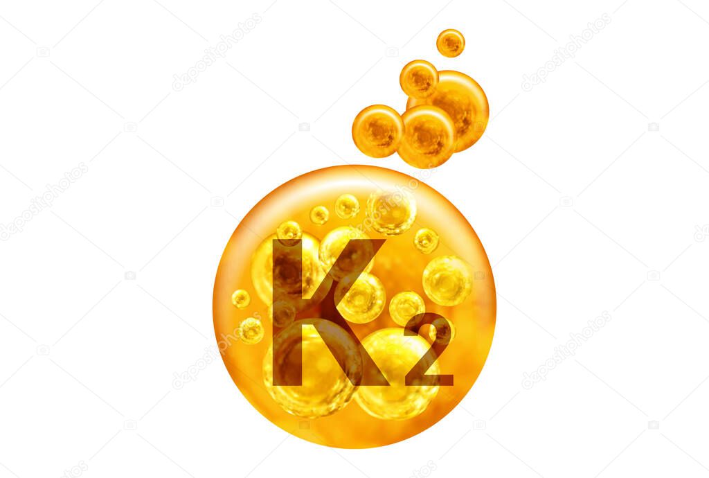  Vitamin K2 capsule. Golden balls with bubbles isolated on white background. Healthy lifestyle concept. 