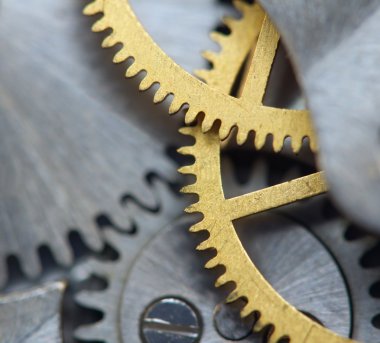 metal cogwheels ile arka plan bir saat gibi. Makro 