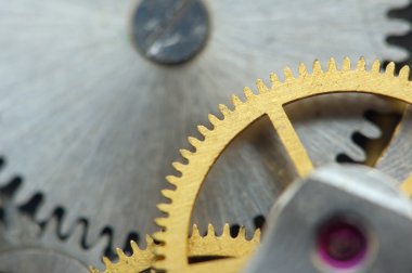 metal cogwheels ile arka plan bir saat gibi. Makro 