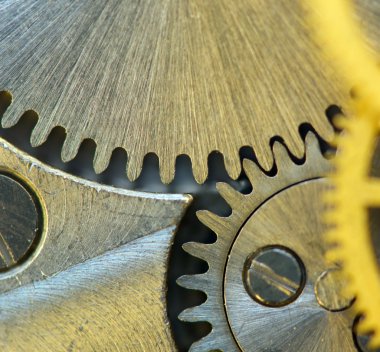 ile metal cogwheels bir clockwork arka plan..