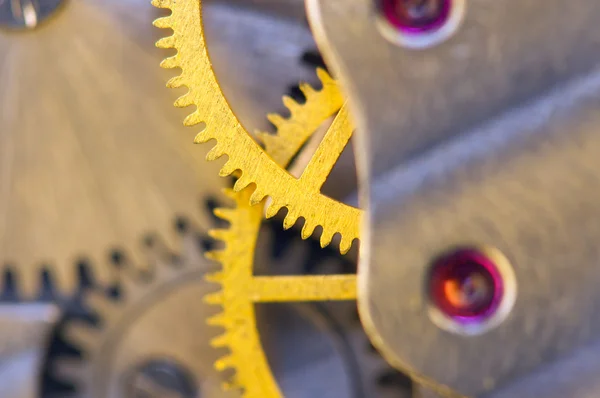 Fondo con ruedas dentadas de metal un reloj . —  Fotos de Stock