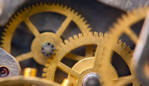 Arrière-plan métallique avec roues dentées en métal une horloge. Macro — Photo