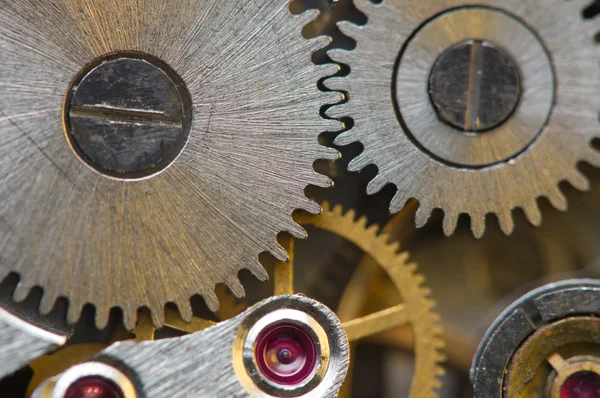 Fondo metálico con ruedas dentadas de metal un reloj. Macro —  Fotos de Stock