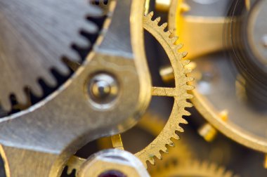 metal cogwheels ile arka plan bir saat gibi. kavramsal fotoğraf