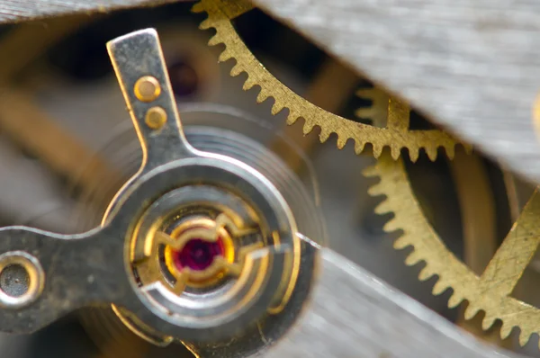 Arrière-plan avec roues dentées en métal une horloge. Macro — Photo