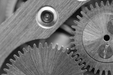 siyah beyaz arka plan ile metal cogwheels bir saat gibi. kavram