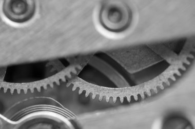 siyah beyaz arka plan ile metal cogwheels bir saat gibi. kavram