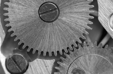 siyah beyaz arka plan ile metal cogwheels bir saat gibi. kavram