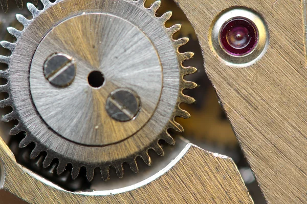 Achtergrond met metalen tandwielen een uurwerk. conceptuele foto — Stockfoto