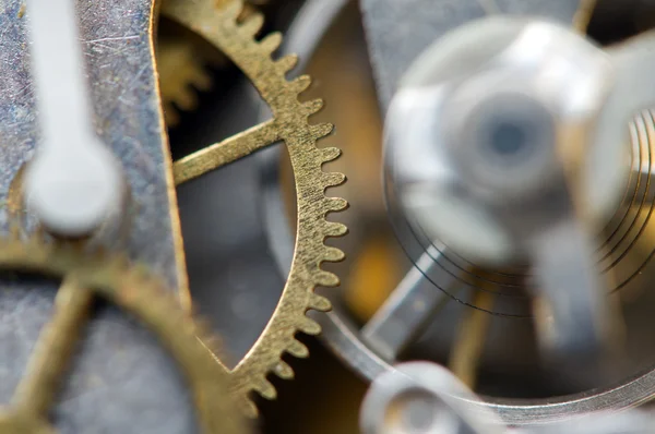 Sfondo con ruote dentate in metallo un orologio. Foto concettuale per — Foto Stock