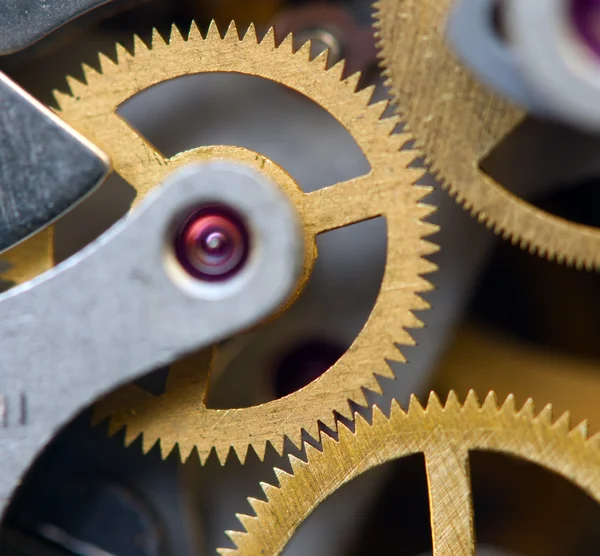 Hintergrund mit Metallzahnrädern ein Uhrwerk. Konzeptfoto — Stockfoto