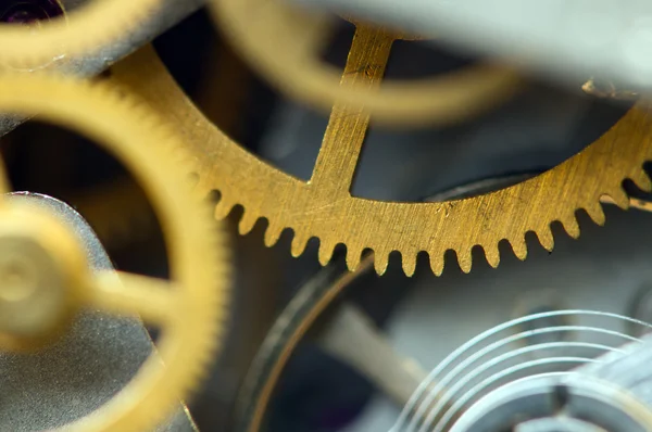 Sfondo con ruote dentate in metallo un orologio. Foto concettuale — Foto Stock