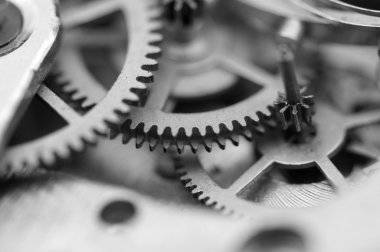 siyah beyaz arka plan ile metal cogwheels bir saat gibi. kavram