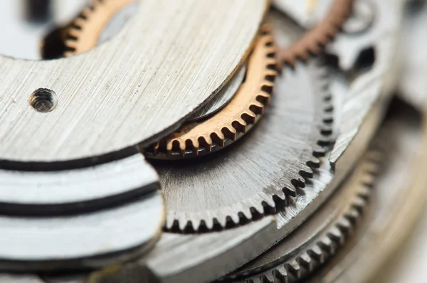 Sfondo con ruote dentate in metallo un orologio. Foto concettuale — Foto Stock