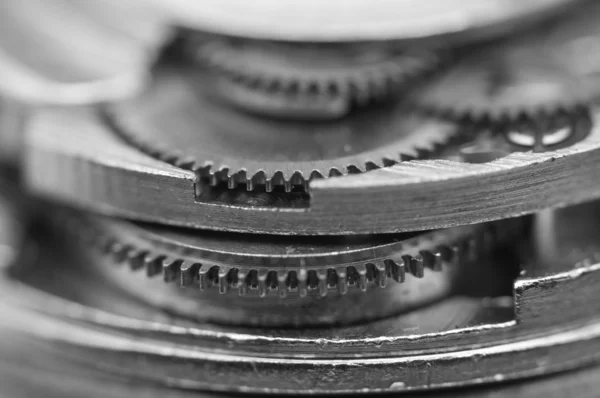 Black and white background with metal cogwheels a clockwork. — Stock Photo, Image