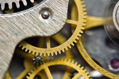 Arka plan ile altın metal cogwheels saat içinde. Başarılı iş tasarımınız için kavramsal fotoğraf. Makro. 
