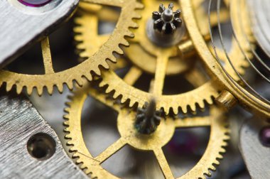 Arka plan ile altın metal cogwheels saat içinde.