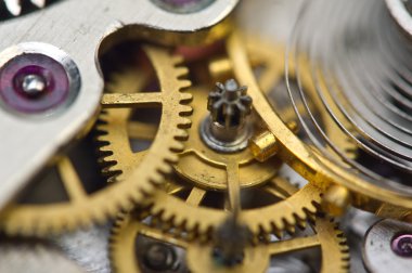 Arka plan ile altın metal cogwheels saat içinde.