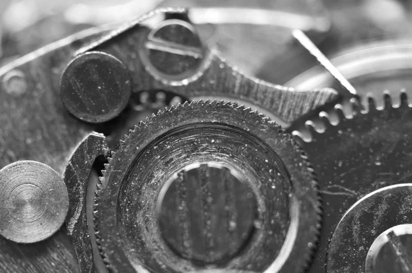 Arrière-plan avec roues dentées en métal une horloge. Macro — Photo