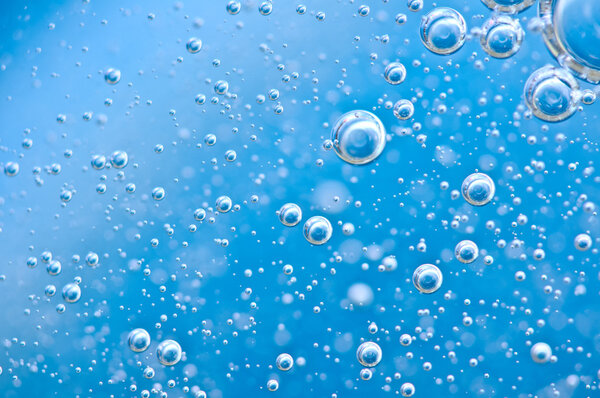 Macro Oxygen bubbles in blue clear water