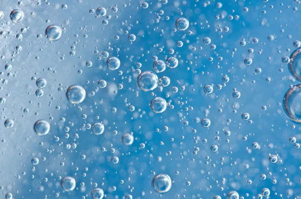 Macro Oxygen bubbles in blue clear water