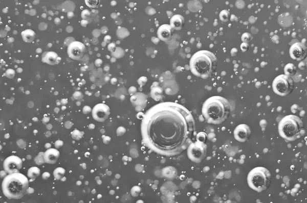 Black-and-white Macro Oxygen bubbles in water — Stock Photo, Image