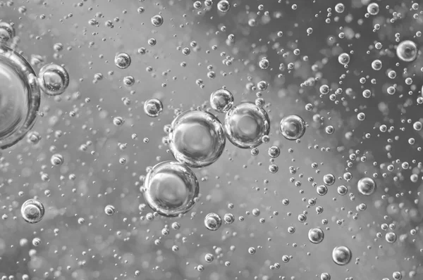 Black-and-white Macro Oxygen bubbles in water — Stock Photo, Image