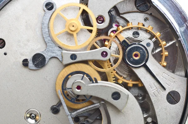 Rodas dentadas de metal dentro do relógio. Foto macro conceitual . — Fotografia de Stock