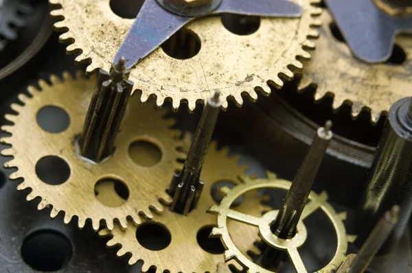 Gearwheels inside clock mechanism. Royalty Free Stock Images