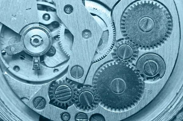 Zahnräder innerhalb der Uhr. Konzept Teamwork. Makro — Stockfoto