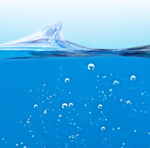 Onda líquido azul com bolhas de ar — Fotografia de Stock