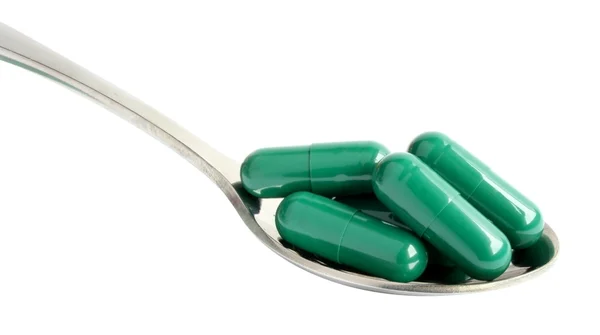 Medicine in a spoon — Stock Photo, Image