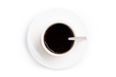 White coffee mug with spoon isolated on white background top view