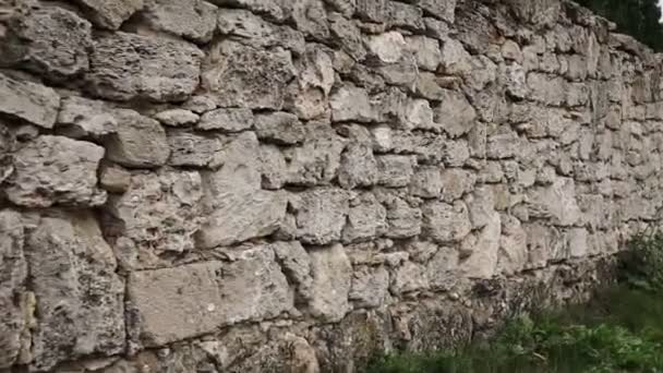 Texture of a stone wall. Old castle stone wall texture background. Stone wall as a background or texture. Camera moving. — Stock Footage Texture Stone Wall Old Castle Stone Wall Texture Background Stone Royalty Free Stock Video